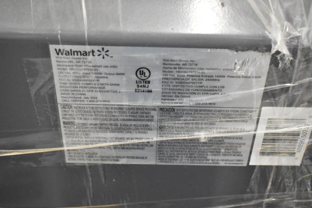2023 Hamilton Beach stainless steel commercial countertop microwave oven, model HB4302797514-01, 120 volts. Tags indicate FCC ID VG8XM9P02Y/YP, 1400W input, 900W output.