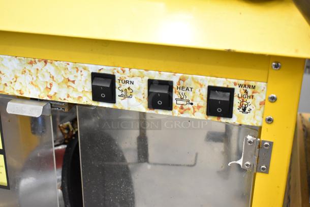 Metal commercial popcorn machine with countertop design, 115 volts, 1 phase. Features turn, heat, and warm/light switches.