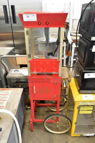 Nostalgia CCP510 red metal popcorn machine on cart, 115 Volts, 1 Phase, with vintage design and visible control switches.