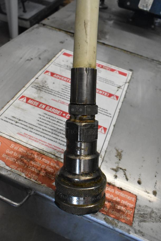 Metal Commercial Portable Filter for Fryer Oil, Model 402. Visible use and residue. Power: 120 Volts, 1 Phase.