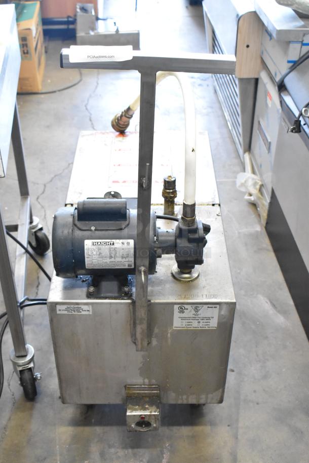 Metal Commercial Portable Fryer Oil Filter, model 402, 120 Volts, 1 Phase. Visible labels detail power specs and safety info.