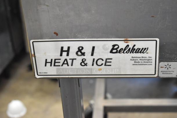 2023 Belshaw H&I-4 stainless steel glazing station, commercial casters, 208-240V, 1 phase, minor wear. Label reads "H&I Heat & Ice."