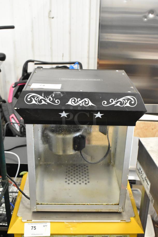 Olde Midway P600 Metal Commercial Popcorn Machine, 120 volts, with decorative star design. Visible wear on surface.