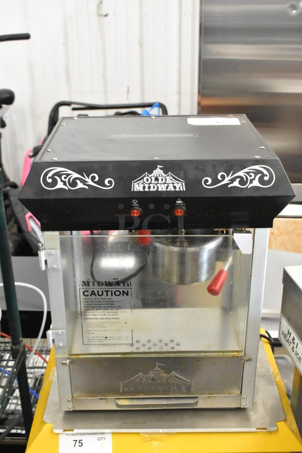 Olde Midway P600 Metal Popcorn Machine, commercial model, 120V, features red handles, caution label, and branding on top.