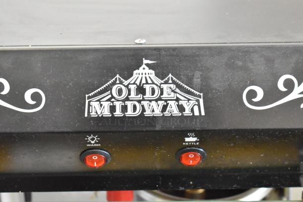 Olde Midway P600 commercial popcorn machine, metal construction, 120V, featuring "Warm" and "Kettle" switches, circus logo.