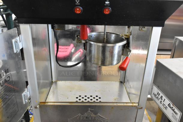Olde Midway P600 Metal Commercial Popcorn Machine, dual switches, used condition, 120 volts, 1 phase, visible marks.