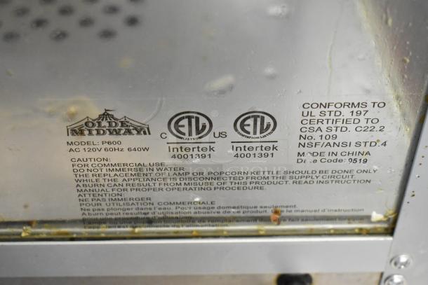 Olde Midway P600 commercial popcorn machine label, 120V, UL Certified, model details, and safety warnings visible.