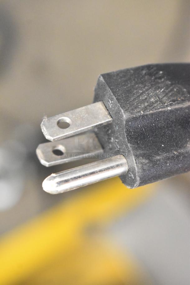 Close-up of a standard 3-prong power plug attached to the 2019 OY-828 Metal Commercial Popcorn Machine, 120 Volts, 1 Phase.
