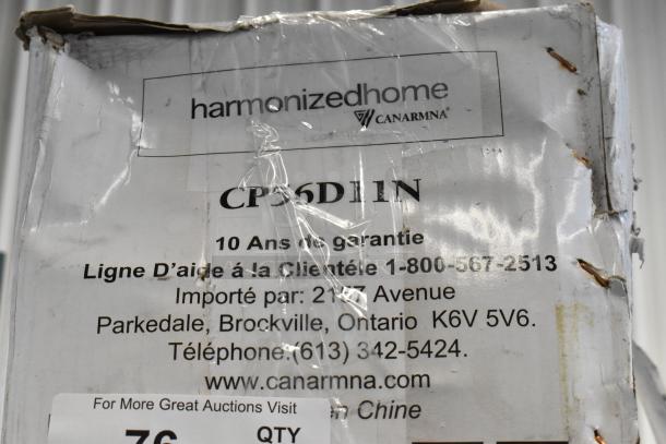 Brand new Canarm CP56D11N 56" industrial ceiling fan in damaged box; includes 10-year warranty label.