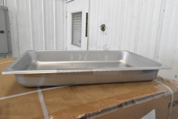 Brand new Vigor full size 2 1/2" deep stainless steel steam table pan, anti-jam, 22 gauge, resting on a box.