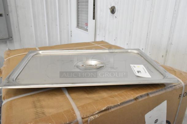 Stainless steel steam table pan cover, Vigor 24711SLD, new, on cardboard box, auction tag visible.