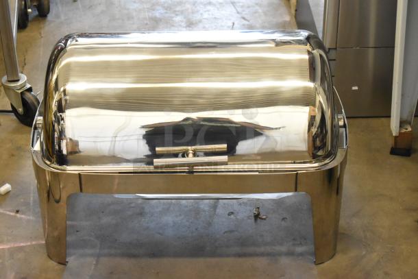 Brand new stainless steel roll top chafing dish, lightly scratched, shiny finish. Ideal for serving hot food at events.