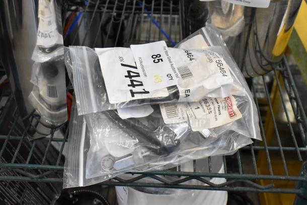 Three Blodgett items new in packaging: Pilot Burner LP 56464, Door Handle 56385, Spark Mod 54725. Auction lot with tags visible.