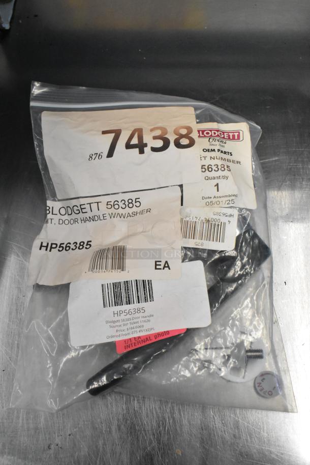 Brand new Blodgett 56385 door handle with washer in original packaging. Labels show part number and assembly details.