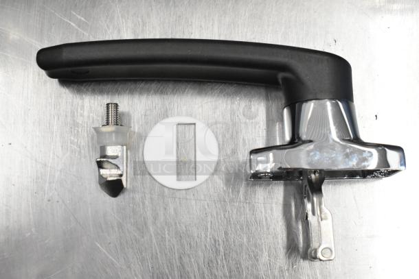 3 new Blodgett parts: 56464 Pilot Burner LP, 56385 Door Handle, 54725 Spark Mod. On stainless surface, undamaged.
