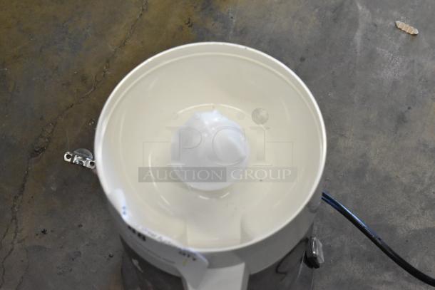 Brand new Sunkist 8-R metal countertop citrus juicer, 115 volts, 1 phase. Slight scratches and dents visible.