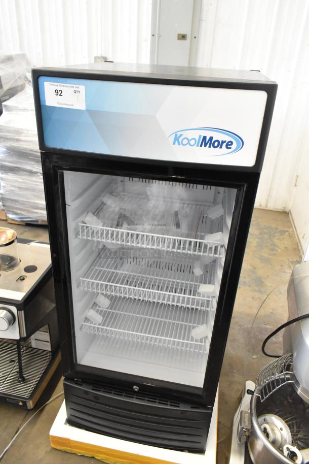 Brand new KoolMore KM-MDR-1D-6C single door cooler with poly-coated racks, 115V, some scratches and dents visible.
