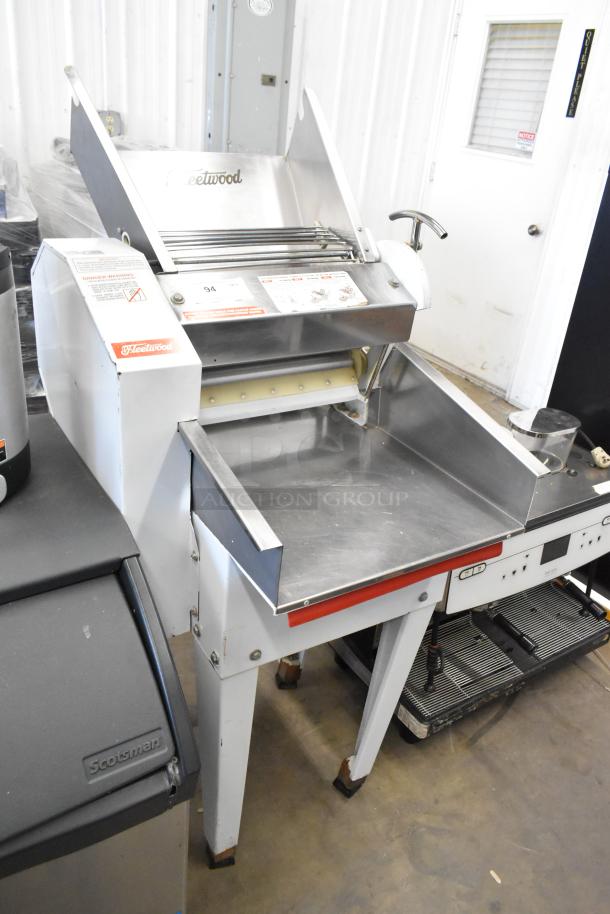 Fleetwood DR-400 metal commercial bread slicer, floor style, 115 volts, 1 phase, visible brand markings, used condition.