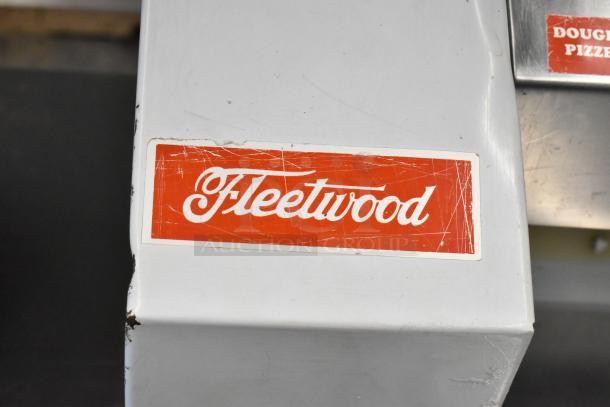 Fleetwood DR-400 metal commercial bread loaf slicer, 115 volts, 1 phase. Visible Fleetwood logo, shows minor wear.