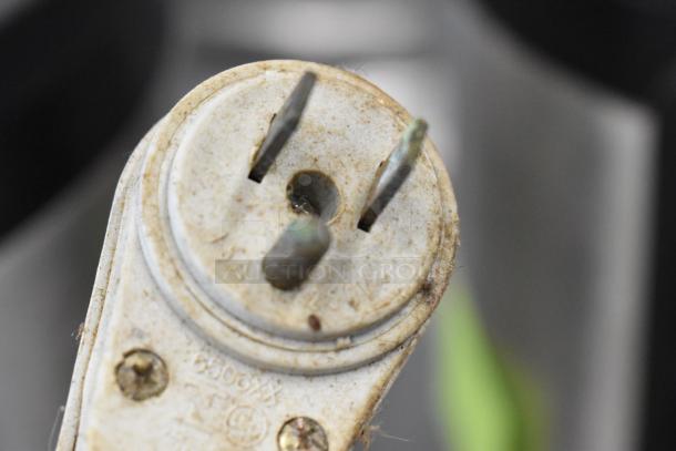 Close-up of Fleetwood DR-400 bread slicer's power plug, showing signs of wear. 115 volts, 1 phase.