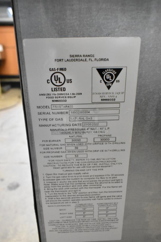 BRAND NEW 2022 Sierra Frystar400 stainless steel natural gas fryer with 2 baskets, scratch and dent condition, model label visible.