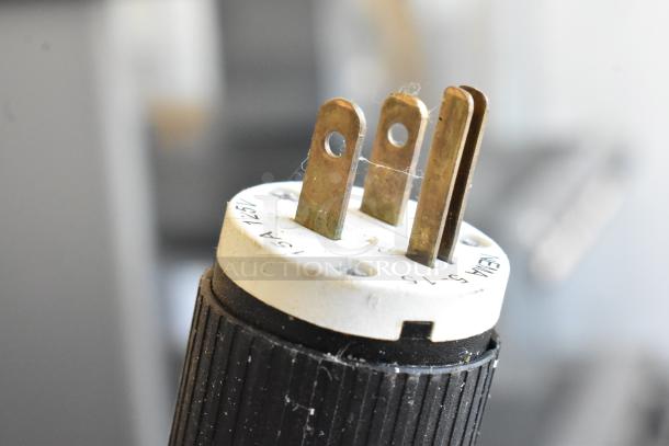 Close-up image of a plug for the Oliver 797-32 Metal Commercial Floor Style Bread Loaf Slicer, showing a 115V, 1-phase connection.