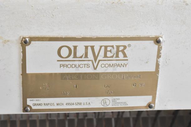 Oliver 797-32 metal commercial bread loaf slicer, 115V, 1 phase. Label indicates model, serial numbers, and UL listing.