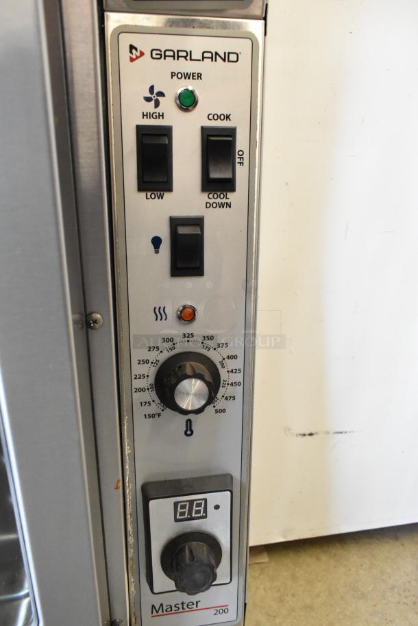 Garland MCO-GS-10S stainless steel commercial convection oven, natural gas, 60,000 BTU, thermostatic controls, view doors.