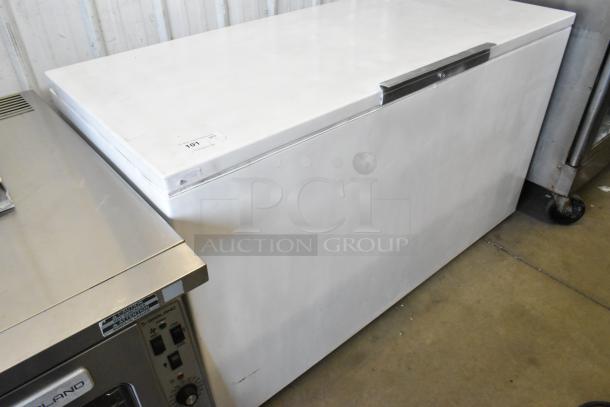 White chest freezer with hinge lid, 115 volts, 1 phase. Good condition, visible identification tag on top left corner.