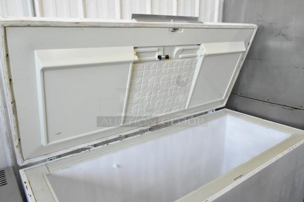 Chest freezer with hinge lid, 115 volts, 1 phase. The interior is spacious and clean, showing minimal wear.