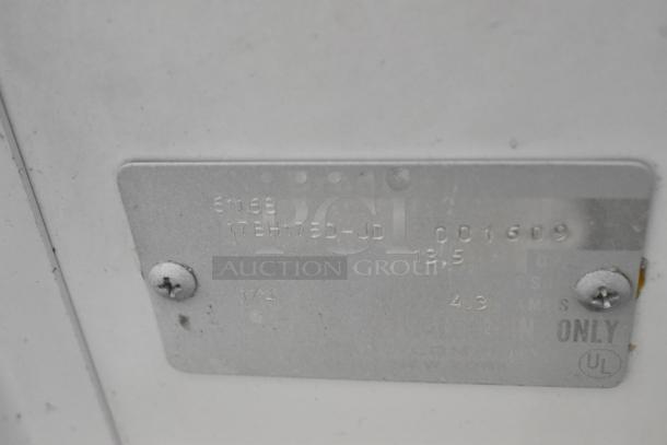 Label detail on chest freezer. Displays model number, specs, and UL certification.