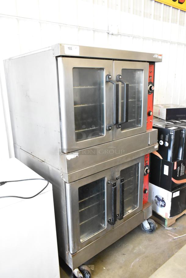 2 Vulcan VC4GD stainless steel convection ovens with view-through doors, metal racks, thermostatic controls, on casters.