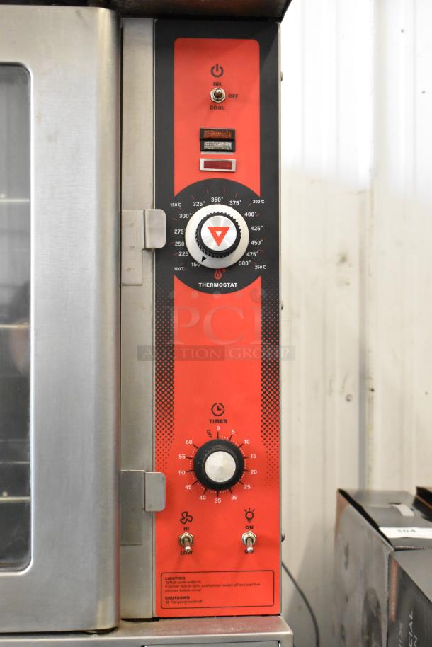 Vulcan VC4GD stainless steel convection oven with view-through doors, metal racks, thermostatic controls, on commercial casters.