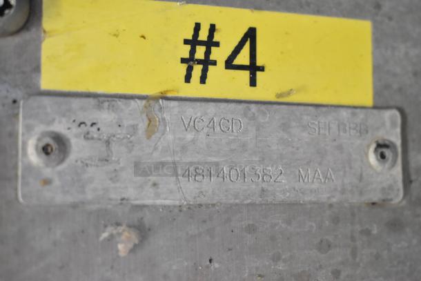 Tag showing Vulcan model VC4GD and serial number 481401382 MAA, on stainless steel surface.