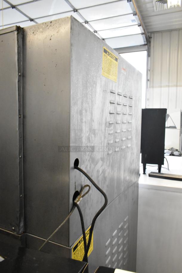 Vulcan VC4GD stainless steel convection oven, gas-powered, view-through doors, metal racks, thermostatic controls, on casters.