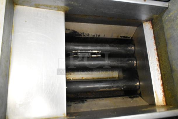 Avantco FF300-N stainless steel commercial deep fat fryer, natural gas, 90,000 BTU, floor style, visible wear.