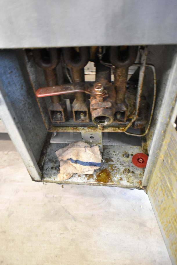 Avantco FF300-N deep fat fryer, stainless steel, natural gas, 90,000 BTU, visible wear and residue, model tag not visible.