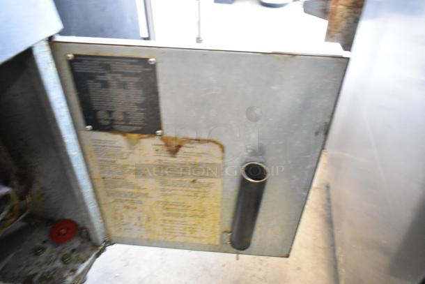 Avantco FF300-N commercial fryer, stainless steel, natural gas, 90,000 BTU. Visible wear on exterior, labels intact.