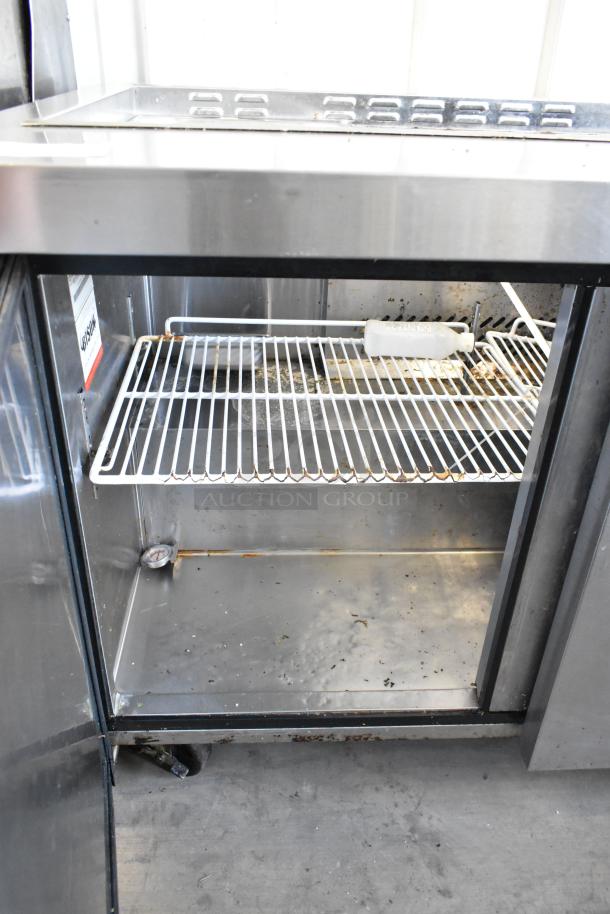 Bison MSF8308 stainless steel prep table with bain marie, commercial casters, 115V, 1 phase, interior shelf. Used condition.