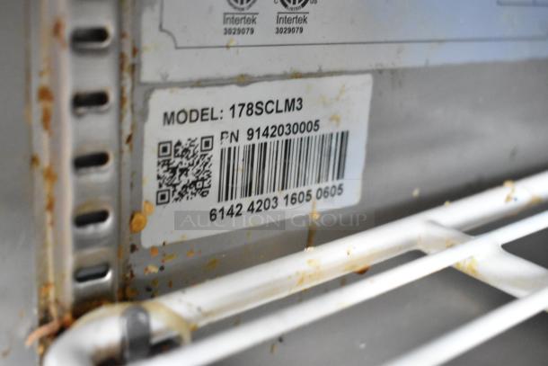Avantco 178SCLM3 label on stainless steel prep table. Model, QR code, and barcode visible; some wear and grime present.