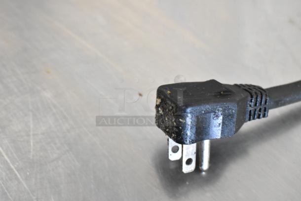 Power plug of Ikon KSP48 commercial prep table, showing wear and some debris on stainless steel surface.