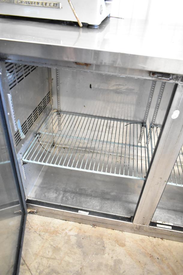 Spartan SSGBB-60 metal 2-door undercounter cooler, commercial use, 115 volts, shelf inside, visible wear, ideal for bar storage.