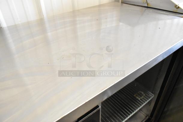 Spartan SSGBB-60 undercounter cooler, metal exterior, two doors, 115V, visible interior shelving, used condition.