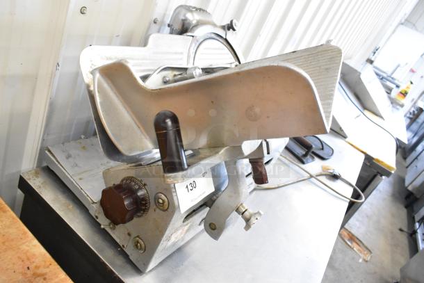 Globe 285 metal commercial countertop meat slicer with blade sharpener, 115V, 1 phase, knob controls, used condition.