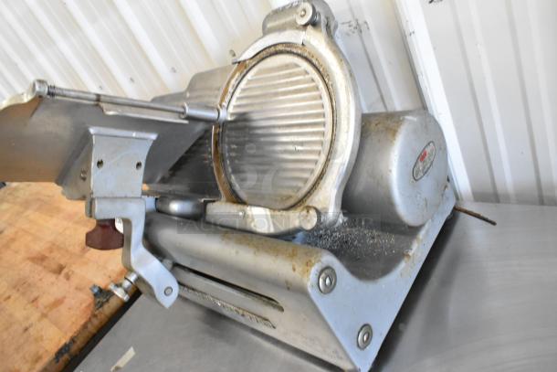 Globe 285 metal commercial countertop meat slicer with blade sharpener. 115 volts, 1 phase. Used condition.
