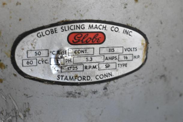 Globe 285 metal meat slicer with blade sharpener, label shows 115 volts, 1 phase, Stamford, Conn, in used condition.