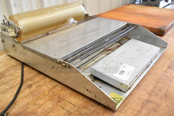 Avantco 177WM18 metal countertop film wrapping machine, single roll, 120V, used condition, label with "133 QTY."