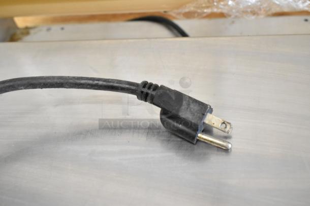 Avantco 177WM18 film wrapping machine power cord, showing standard 120-volt plug. Appears in good condition.