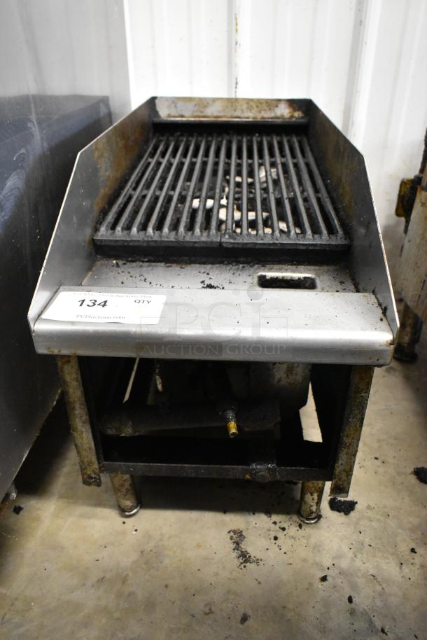 Metal commercial gas charbroiler grill, used condition, visible wear and residue on grates. Auction tag reads "134 QTY."