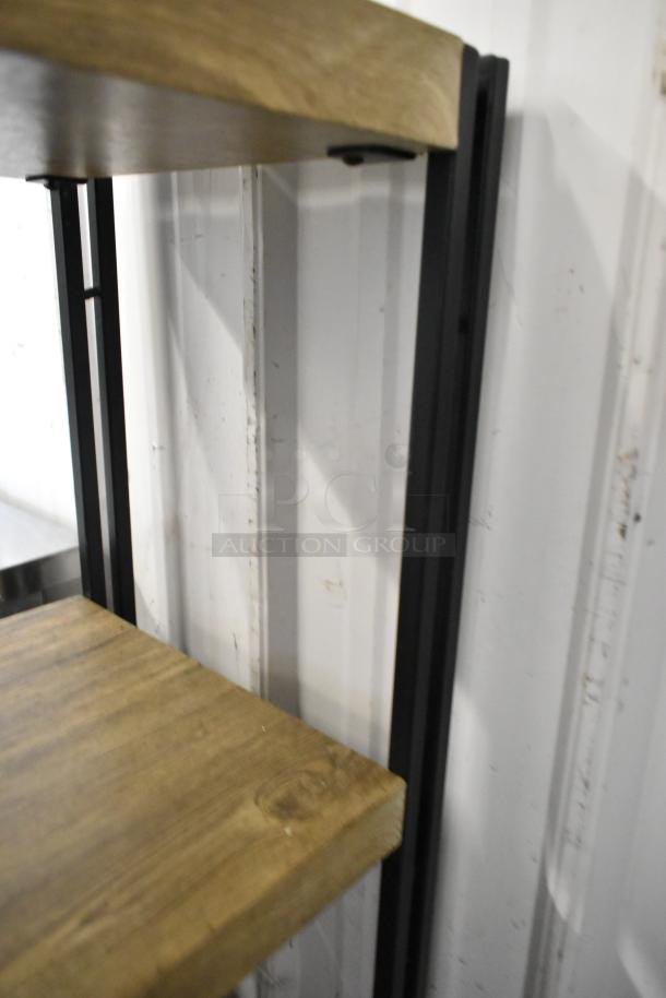 Wooden 4 tier shelving unit with black metal frame, featuring natural wood finish. Sturdy construction, modern design.